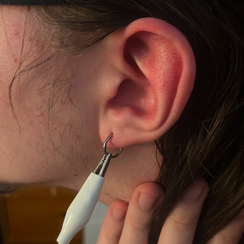 I was curious to see if connecting the earring someone was wearing would make them conductive. It did.